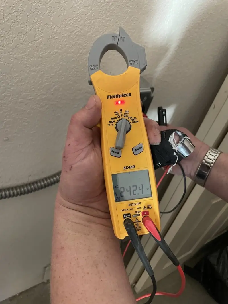 Voltage testing with clamp meter during Generator Installation in Marlene Village